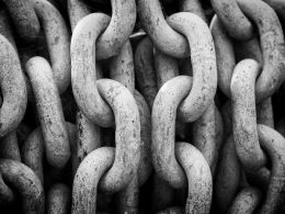 Blockchain And Identity Verification: Anonymity Versus Trusted Participant